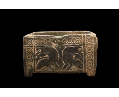 Ca. 2000 - 1000 BC. A finely carved Bactrian cosmetic palette made from a light-weight stone possibly anthracite. Rectangular