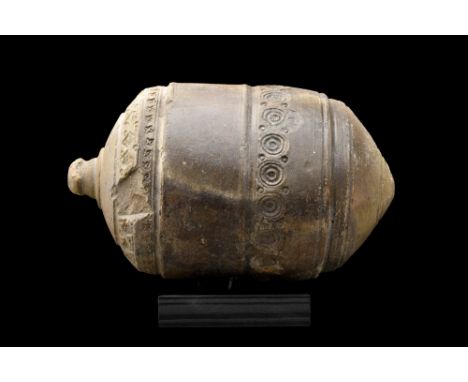 Ca. 800-1000 AD. A late Roman, early Byzantine glazed ceramic grenade, also referred to as "Greek Fire". This hollow ceramic 