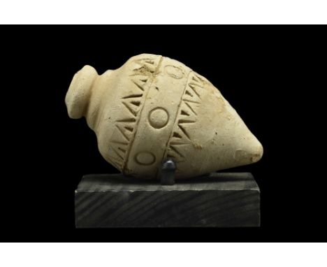 Ca. 800-1000 AD. A ceramic grenade, also referred to as 'Greek Fire'. This hollow ceramic vessel consists of a piriform body,