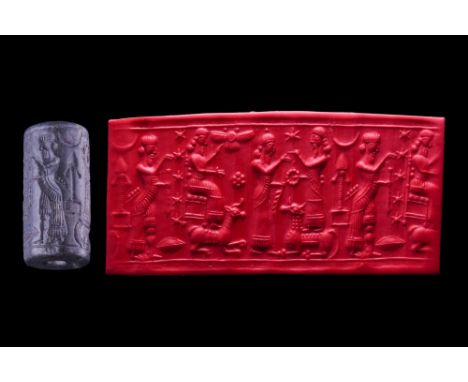 Ca. 8th-7th century BC or later. A finely carved Neo-Babylonian/Chaldean cylinder seal with kingly figures and deities (Arwiu