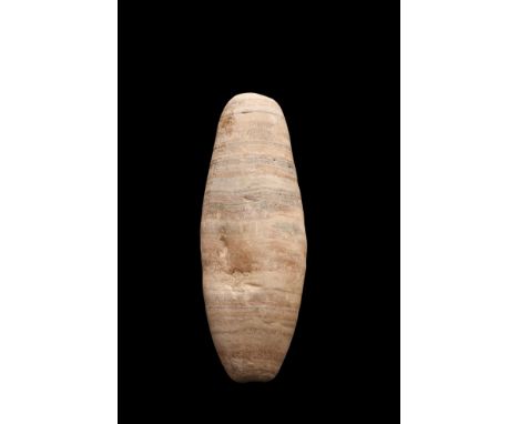 Ca. 3000 BC. An alabaster idol of cylindrical form with rounded ends and drilled interior. Stone idols like this example are 