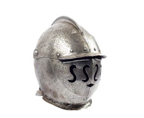 An Italian close-helmet of Savoyard form, the two-piece skull with short turned comb, visor pierced with small angular mouth,