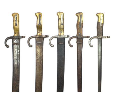 A French Chassepot bayonet, dated 1874, together with another similar dated 1877, and one with indistinct date, all with scab