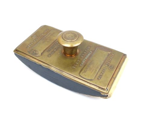 A rare embossed brass Eley-Kynoch desk blotter, the upper face decorated with two cartridge profiles, the first an ALPHAMAX H
