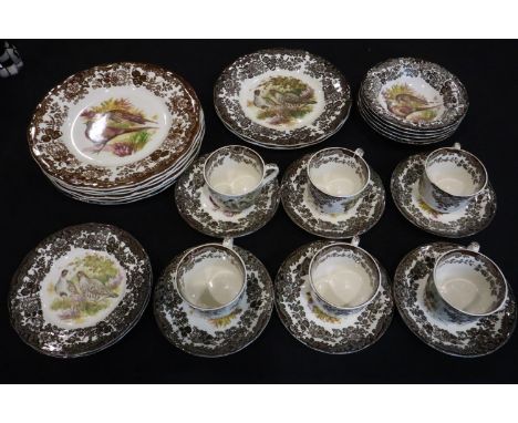 Royal Worcester Palissy tea and dinnerware of twenty seven pieces in the Game Series pattern, small signs of age throughout. 