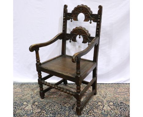 Carved oak armchair with Bobbin stretcher in the Jacobean style. Not available for in-house P&amp;P