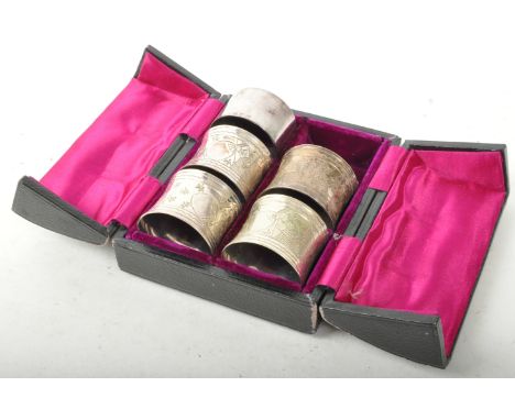 A collection of early 20th century silver plate napkin holder / rings. Having engraved decoration featuring spiders webs and 