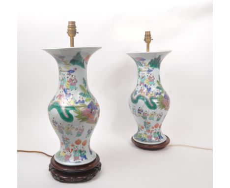A pair of vintage 20th century Chinese hand painted ceramic converted lamp vases. With light fixings to top, hand painted bod