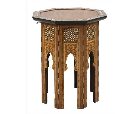 An octagonal inlaid and mother-of-pearl lamp table, with an hinged top over arcaded supports, 41cm diameter 53cm high