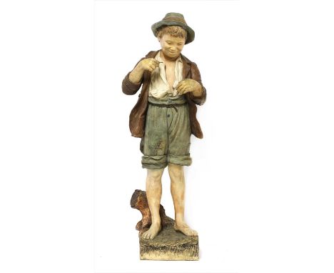 A Goldscheider terracotta figure, 'Country Boy', modelled as a scruffily dressed boy, inscribed 'Goldscheider Wien 53', stamp