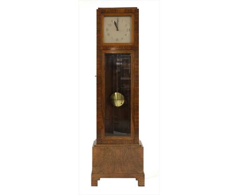 An Art Deco walnut longcase clock , with a bronzed square dial with chrome Arabic hours, with a three train Westminster chime