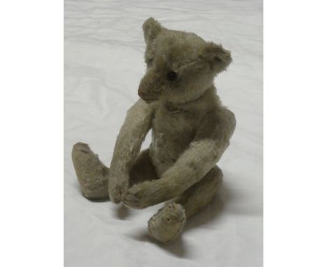 An unusual old plush covered teddy bear by Steiff with maker's button to ear 10" long