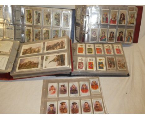 Four albums containing a selection of sets and part sets of cigarette cards - mainly military, naval and history cigarette ca