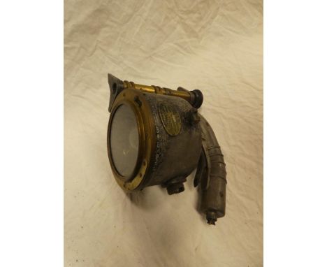An old brass mounted metal Admiralty pattern signalling lamp