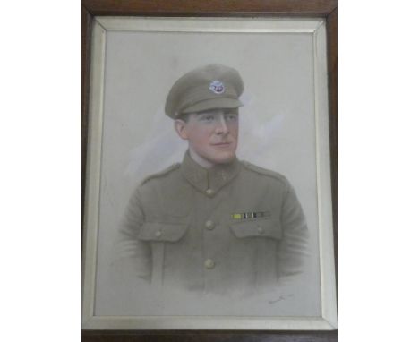 A First War pastel painting on photograph depicting a bust portrait of a soldier in the DCLI, dated 1917