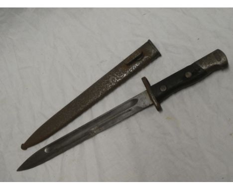 A Middle East bayonet with single edged blade in steel scabbard