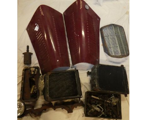 A selection of various old motoring parts including Morgan 4/4 bonnet, various other Morgan engine parts, Morris radiator gri