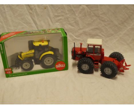 A Siku 3051 Massey Ferguson Tractor, mint/boxed; and a Britains/Ertl unboxed heavy tractor (2)