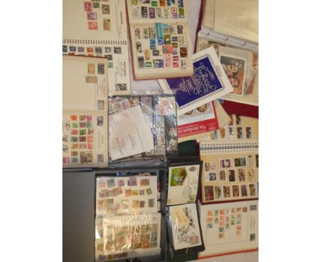 Numerous albums of various World stamps, first day covers, packets of stamps, stock cards of mixed stamps, etc