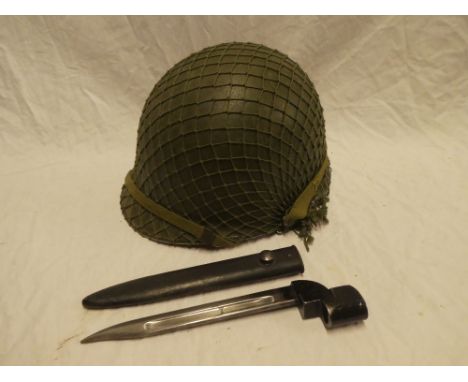 An American steel combat helmet and a British No. 9 Mk1 bayonet and scabbard (2)