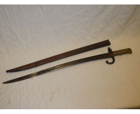 A French M1866 Chassepot bayonet with single edged blade and German markings in steel scabbard