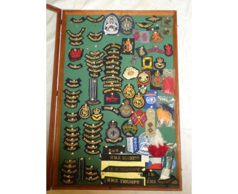 A selection of various military badges and other badges including Civil Defence Corps badges with various shoulder titles, po