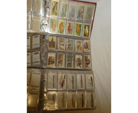 Three albums of sets and part sets of cigarette cards including Ogden's - Smugglers and Smuggling; Ogden's - The Blue Riband 