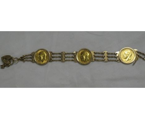 Three gold sovereigns 1929, 1923 and 1932, clip mounted in a gate link bracelet with 9ct gold padlock clasp