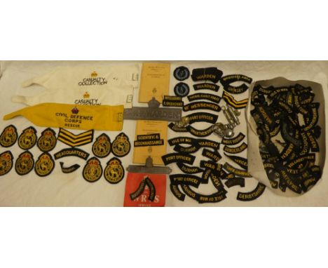 A selection of Civil Defence and ARP badges and insignia including two aluminium ARP Warden gate notices, two ARP whistles, v