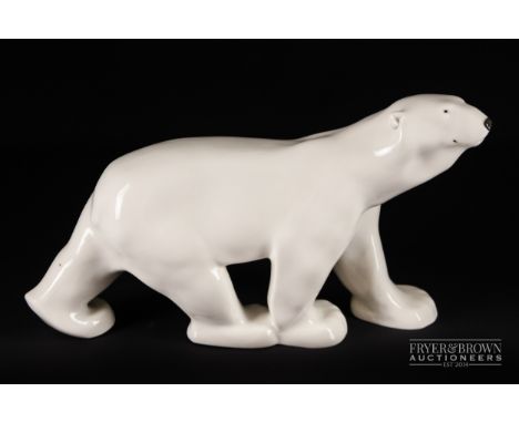 Style of Francois Pompon - a ceramic polar bear, in white with black painted features, 46.5cm