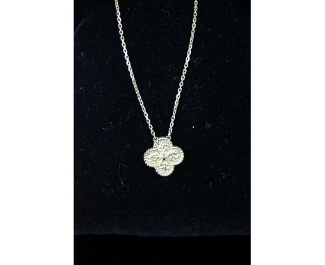 Van Cleef and Arpels - a rose coloured 18ct gold 'Alhambra' pendant and chain, signed VCA, numbered JB131028