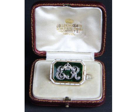 A rare royal presentation diamond enamel and gold brooch c1910, of rectangular canted corner shape, the central guilloche pla