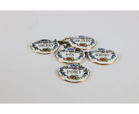 A vintage Crown Staffordshire set of five ceramic wine labels, whisky, sherry, brandy, gin and port, all with floral foliate 