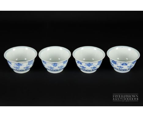 Four Chinese blue and white tea bowls, decorated with precious objects above a band of 'c' scroll strap work, six character m