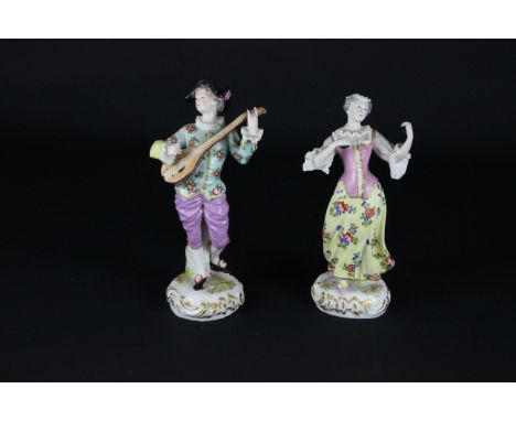 A pair of Continental figures of musicians, she playing castanets, he a lute on foliate scroll bases, Frankenthal style mark 