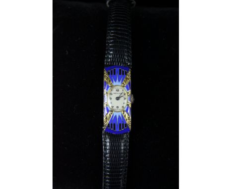 Mervos - An Art Deco 18ct and enamel ladies wrist watch, c1925, the oval shaped silver coloured dial with black enamelled num