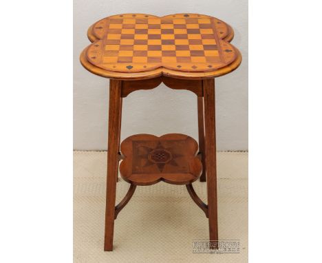 An attractive Arts and Crafts inlaid occasional table, c1900, possibly by Liberty London, the quatrefoil shaped top inlaid as