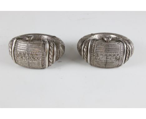 A pair of northern Omani womans white metal wedding or Nizwa anklets, probably Muscat region, late 19thC, heavy hollow struct