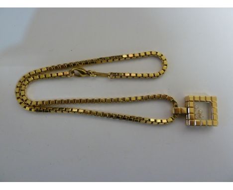 Chopard Geneve Happy Diamonds, an 18ct yellow gold 'ice cube' pendant on chain, in original box, with original certificate fr