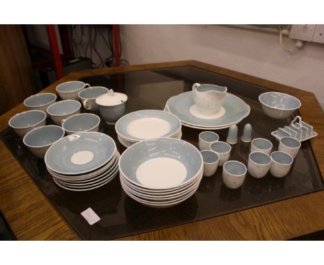 A Susie Cooper Raised Spot pattern in pale blue, comprising seven side plates; seven bowls; 8 saucers; seven teacups; sugar b