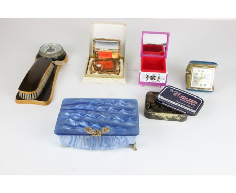 A boxed Stratton musical compact, gilt finish, the faux mother of pearl top decorated with a musical stave picked out in diam