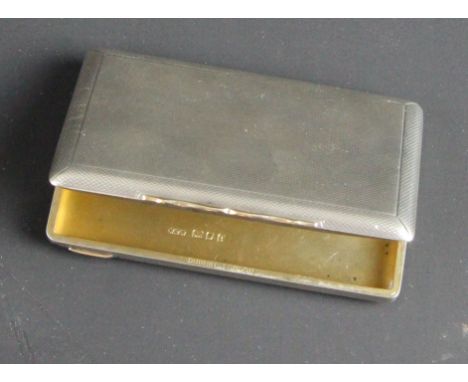 Dunhill London, a silver engine turned card case with gold push piece, London 1924 signed Dunhill London and inscribed inside