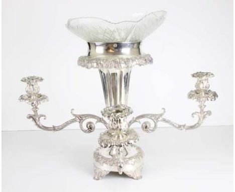 A silver plated and cut glass four light centrepiece, the glass bowl supported on a vase shaped column with fruiting vine edg