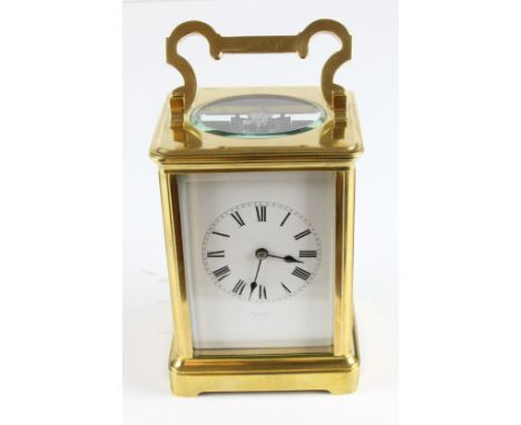 A good quality medium size late 19thC French striking carriage clock, the white enamel dial with black enamelled numeral in a