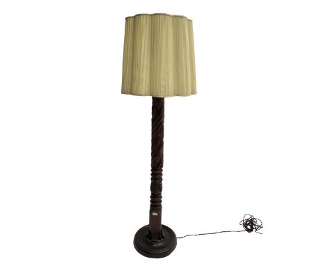 20th century mahogany standard lamp, the rope twist column turned and carved with acanthus leaves, on circular base, with sha