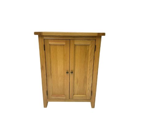 Solid light oak cupboard, fitted with two panelled doors enclosing two shelves, on tapered feetDimensions: Height:&nbsp;101cm