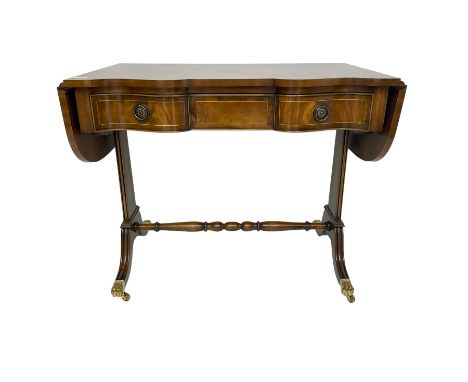 Georgian design mahogany sofa table, shaped drop leaf top over three drawers, on tapered end supports joined by turned stretc