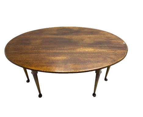 Large oak dining table, oval drop leaf top, double gate-leg action base, cabriole supportsDimensions: Height: 76cm  Length/Wi