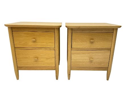 Pair light oak two drawer bedside chestsDimensions: Height:&nbsp;61cm&nbsp; Length/Width:&nbsp;54cm&nbsp; Depth/Diameter:&nbs