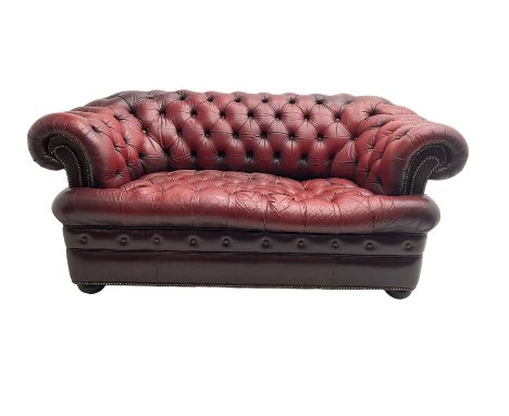 Chesterfield two seat sofa, upholstered in buttoned oxblood leather with studworkDimensions: Height:&nbsp;70cm&nbsp; Length/W